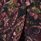 Close-up of the Figue Robin Blazer, a fall piece showcasing an abstract floral design with pink, green, and black swirls, complemented by a textured button.