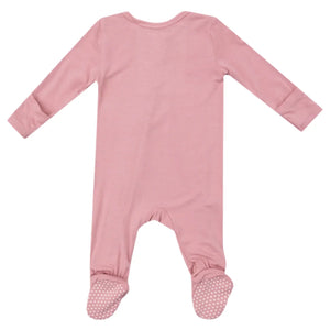 Introducing the Angel Dear Bamboo Bridal Rose 2 Way Zipper Footie: a soft pink infant onesie made from luxurious bamboo fiber fabric. It boasts long sleeves, covered feet, and features a practical two-way zipper footie design. The soles are adorned with polka dot grips for added safety, while fold-over cuffs ensure tiny hands remain warm and snug.