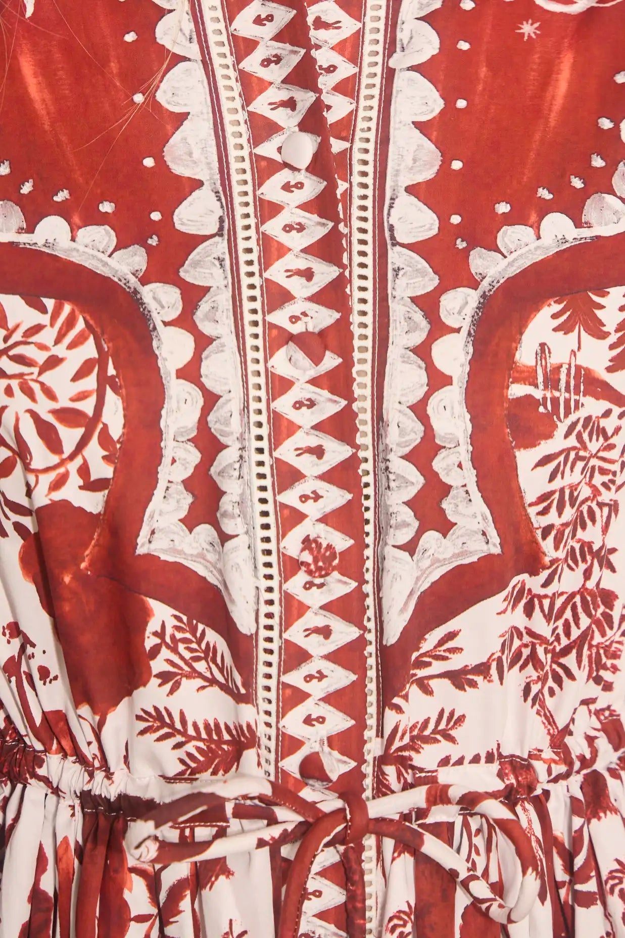 Close-up of the Rosie Dress by Hunter Bell NYC in Central Park Toile, showcasing intricate patterns, lace trim, zigzag stitching, and a waist drawstring—an ideal choice for the holiday season.