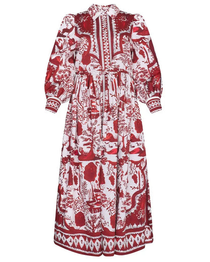 The Rosie Dress by Hunter Bell NYC is a long-sleeve, ankle-length dress in a red and white Central Park Toile print, featuring a high collar and button-down front—ideal for the holiday season.