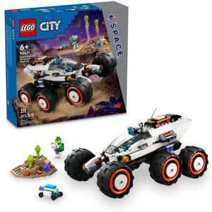 Description: The LEGO® City Space Explorer Rover and Alien Life set by Legos - Toyhouse includes a detailed rover, two astronaut figurines, alien figures, and rocky terrain. With 311 pieces, including energy crystals, it's perfect for ages 6 and up. Box image in the background.