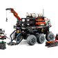 Introducing the LEGO® Technic Mars Crew Exploration Rover from Legos - Toyhouse, a meticulously crafted model showcasing a six-wheeled design complete with a crane arm, control station, and an array of accessory components to navigate Martian landscapes.