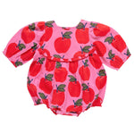 The Pink Chicken Baby Girls' Rowan Bubble romper in pink features long sleeves, graphic apples with green leaves, and glitter buttons.