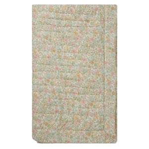The Felicidad Padded Blanket by Bonpoint features a pastel floral pattern in pink, green, and yellow Liberty fabric, displayed on a white background.
