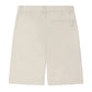 The Boys' Elois Short by Bonpoint is a beige, knee-length style for boys, made from organic cotton with belt loops and a right-side back pocket, shown from the back.