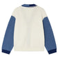 The Bonpoint Boys' Loris V-neck Cardigan features a cream body, blue sleeves, and dark blue cuffs in a three-tone design, shown from the back.