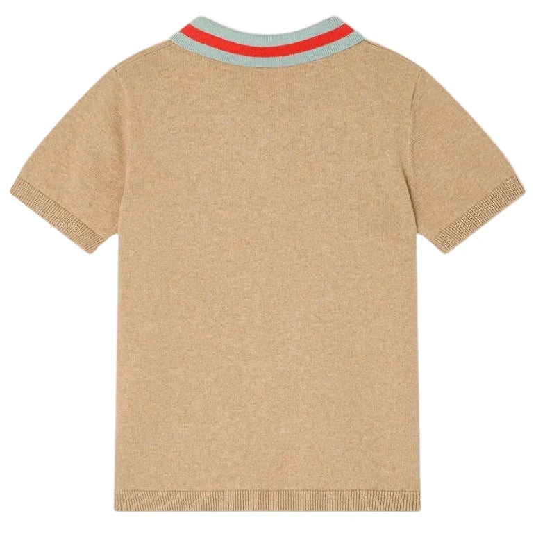 The Bonpoint Boys' Loyal Polo with Inlay 75 Flag is a short-sleeve beige retro shirt, seen from the back, with ribbed cuffs and a light blue striped collar accented by two red stripes.