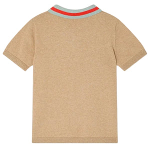 The Bonpoint Boys' Loyal Polo with Inlay 75 Flag is a short-sleeve beige retro shirt, seen from the back, with ribbed cuffs and a light blue striped collar accented by two red stripes.