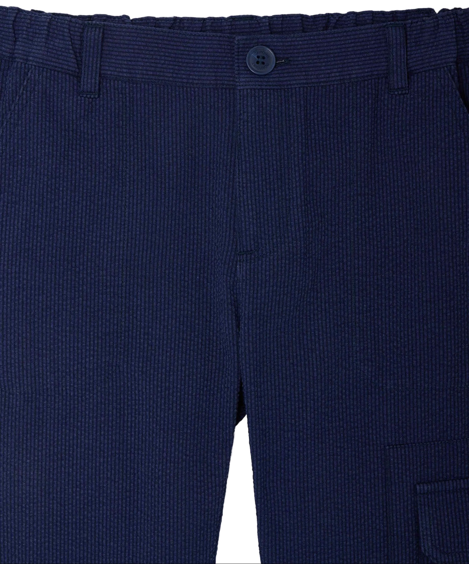 Close-up of Bonpoint Boys' Francis Cargo Trousers in dark blue organic cotton, featuring a button closure, belt loops, adjustable waist, and visible pockets.