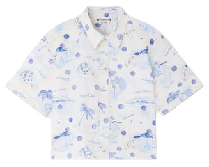 The Boys' Erian Shirt by Bonpoint features short sleeves and a button-up front, made from soft organic cotton in white with blue island-themed illustrations of palm trees, sailboats, and waves.