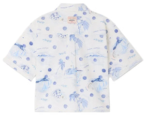 The Boys' Erian Shirt by Bonpoint is a short-sleeved, button-up shirt for boys, made from organic cotton with a white base and blue island-inspired prints featuring palm trees, sailboats, water, and handwritten phrases.