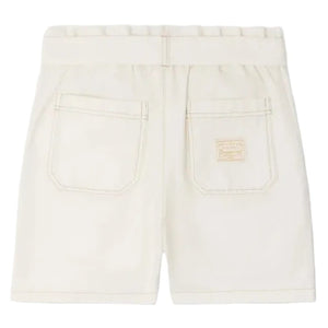 Back view of Bonpoint Girls' Lorrie Shorts in beige, featuring an elastic waistband, two rear pockets, and a small rectangular patch above the right pocket.