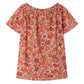 The Girls' Goldia blouse in Liberty Fabric by Bonpoint features short sleeves and a gathered neckline, decorated with a red, pink, and orange floral print on a light background.