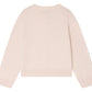 The Bonpoint Girls' Elisea Round Neck Cardigan in Organic Cotton is displayed flat with the back facing up, showcasing its light pink color, long sleeves, and openwork knit design.
