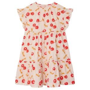 The Bonpoint Girls' Leontine Dress with Ruffles is cream-colored, features short sleeves, a ruffled collar, and an all-over red cherries print.