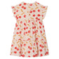 The Bonpoint Girls' Leontine Dress with Ruffles features a cherry print on light pink, short ruffled sleeves, and a loose, flowing fit for a playful style.