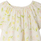 Bonpoint Girls' Smocked Salomé Dress features a charming cherry print with yellow cherries and green leaves, crafted from organic cotton with a gathered neckline and short sleeves.