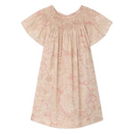 The Bonpoint Girls' Arlene Dress features hand-embroidered smocking, short sleeves, knee-length cut, pink and cream floral Liberty fabric, a gathered neckline, and loose fit. Displayed on a white background.