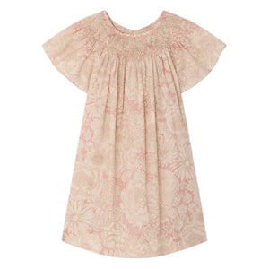 The Bonpoint Girls' Arlene Dress features hand-embroidered smocking, short sleeves, knee-length cut, pink and cream floral Liberty fabric, a gathered neckline, and loose fit. Displayed on a white background.