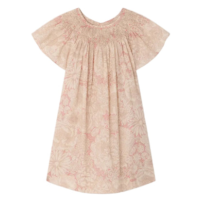 The Bonpoint Girls' Arlene Dress features hand-embroidered smocking, short sleeves, knee-length cut, pink and cream floral Liberty fabric, a gathered neckline, and loose fit. Displayed on a white background.