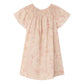 Bonpoint Girls' Arlene Dress features hand-embroidered smocking, a round neckline, and short sleeves. Made from Liberty fabric, this light pink and beige floral dress offers a loose, comfortable fit.