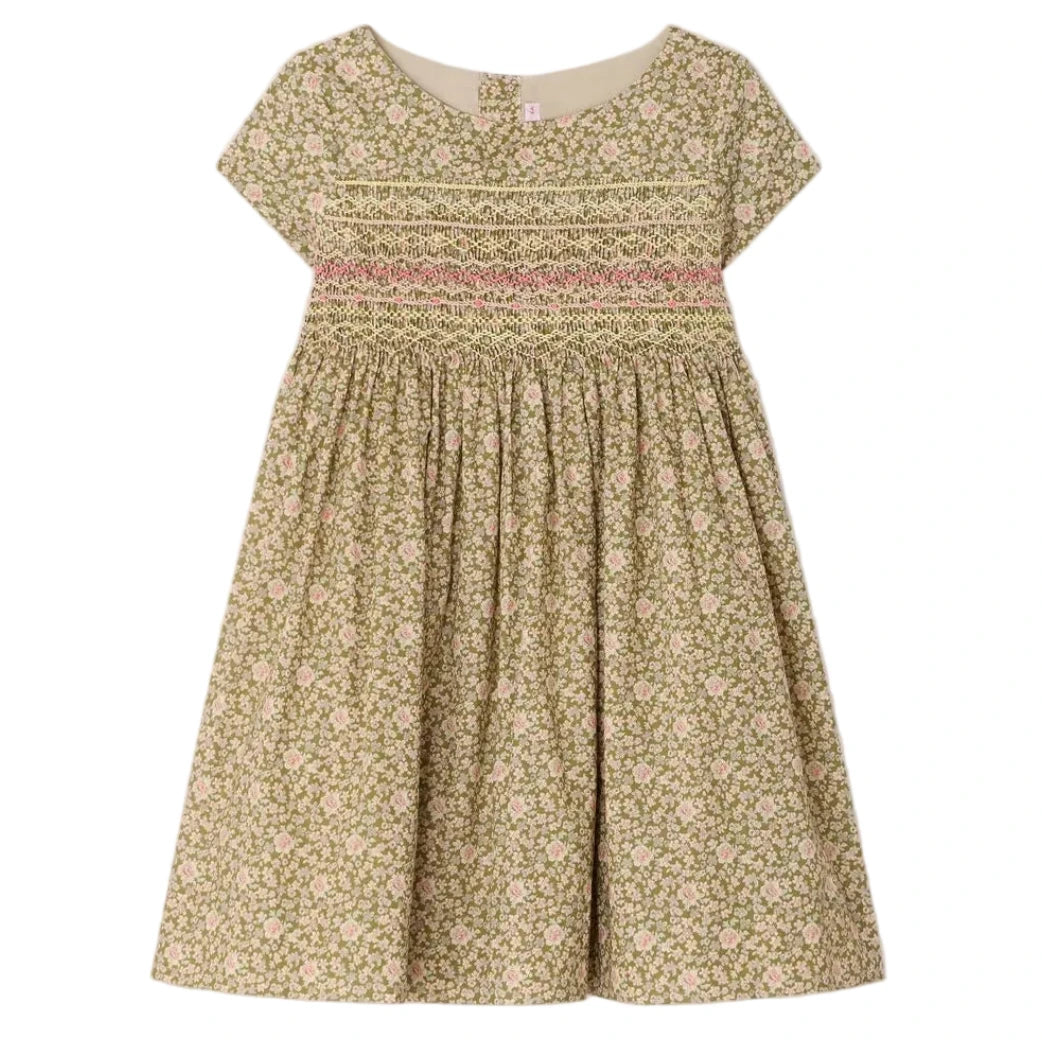 The Bonpoint Girls' Duchesse Smocked Dress features short sleeves, a knee-length cut, floral print in beige, green, and pink, and hand-embroidered smocking across the chest.