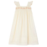 The Bonpoint Girls' Laora Dress is cream-colored and sleeveless, featuring ruffled straps, pink geometric hand-embroidered smocking on the chest, and a gathered skirt for a relaxed fit.