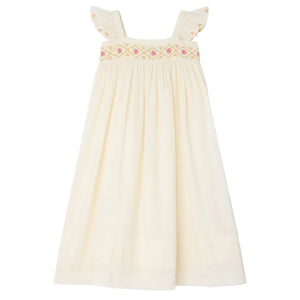 The Bonpoint Girls' Laora Dress is cream-colored and sleeveless, featuring ruffled straps, pink geometric hand-embroidered smocking on the chest, and a gathered skirt for a relaxed fit.