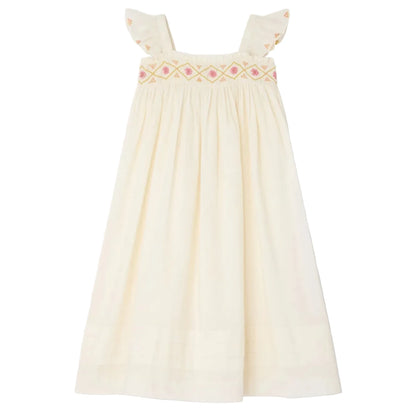 The Bonpoint Girls' Laora Dress is cream-colored and sleeveless, featuring ruffled straps, pink geometric hand-embroidered smocking on the chest, and a gathered skirt for a relaxed fit.