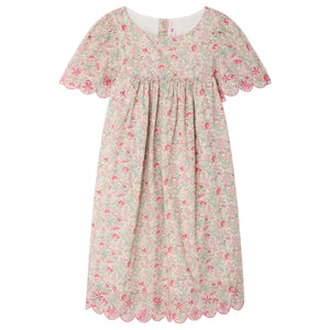 The Bonpoint Girls' Lysiane Dress features English embroidery, a gathered bodice, scalloped edges, and a charming pink floral print on soft Liberty fabric.