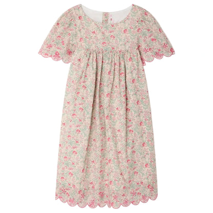 The Bonpoint Girls' Lysiane Dress features English embroidery, a gathered bodice, scalloped edges, and a charming pink floral print on soft Liberty fabric.