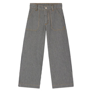 Bonpoint Girls Jingle Striped Denim Trousers: black-and-white vertically striped wide leg pants with pockets and button closure, shown laid flat on a white background.