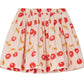 The Girls' Suzon Skirt by Bonpoint is a short, pleated skirt made from organic cotton with a white base, decorated with red cherry prints and yellow-brown stems and leaves.