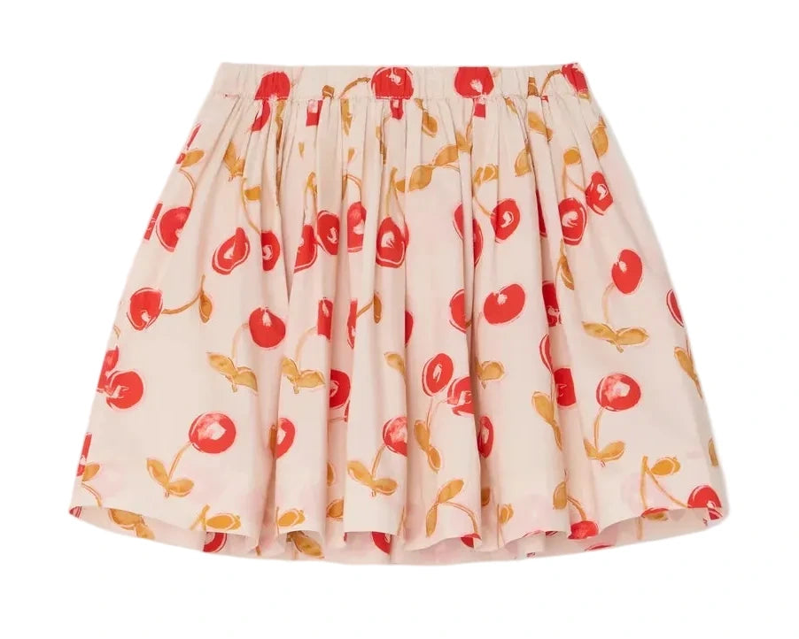 The Bonpoint Girls' Suzon Skirt features a cream hue with a cheerful cherry and yellow leaf print, crafted from soft organic cotton. It has a gathered elastic waistband and flared silhouette for playful comfort.