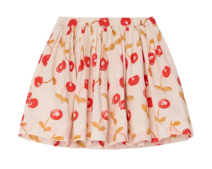 The Bonpoint Girls' Suzon Skirt features a cream hue with a cheerful cherry and yellow leaf print, crafted from soft organic cotton. It has a gathered elastic waistband and flared silhouette for playful comfort.