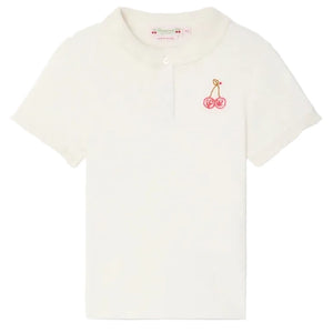 The Bonpoint Girls' Gina T-Shirt features short sleeves, a ruffled Peter Pan collar, and a small embroidered cherry on the left chest.