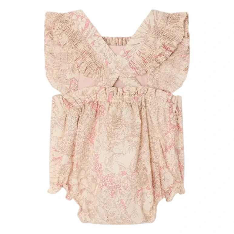Bonpoint's Baby Girls' Lakiss Romper features smocked, hand-embroidered Liberty fabric with ruffled straps, elastic waist and leg openings, and a beige and pink floral print in soft organic cotton.
