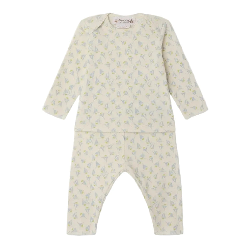The Bonpoint Baby Timi Set features a cream, long-sleeve top and matching pants made from organic cotton, both adorned with a subtle sailboat print.