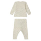 The Bonpoint Baby Timi Set features a cream two-piece design with a sailboat print, including a long-sleeve top and pants crafted from soft organic cotton. Shown laid flat with the back facing up.