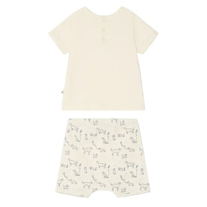 The Bonpoint Baby Boys' Fanilo Embroidered and Dog-Print Set features a short-sleeved cream organic cotton top with back snap buttons and matching shorts, both adorned with a simple black dog and kite print.