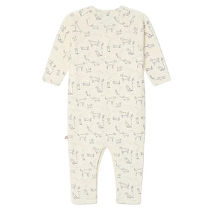 The Bonpoint Baby Boys' Georget Pajamas feature a cream-colored, long-sleeve onesie with simple black dog prints, crafted from soft organic cotton for your baby's comfort.
