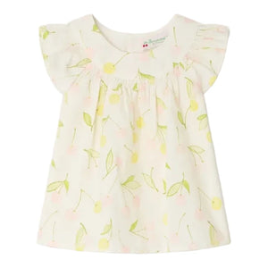 The Bonpoint Baby Girls' and Girls' Lala Blouse is a light-colored cherry print top with short flutter sleeves, featuring yellow and pink cherries with green leaves, crafted from organic cotton and finished with mother-of-pearl buttons.