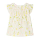 The Bonpoint Baby Girls' and Girls' Lala Blouse is a white organic cotton top with short flutter sleeves, a yellow and green cherry print, and mother-of-pearl buttons, shown laid flat against a white background.