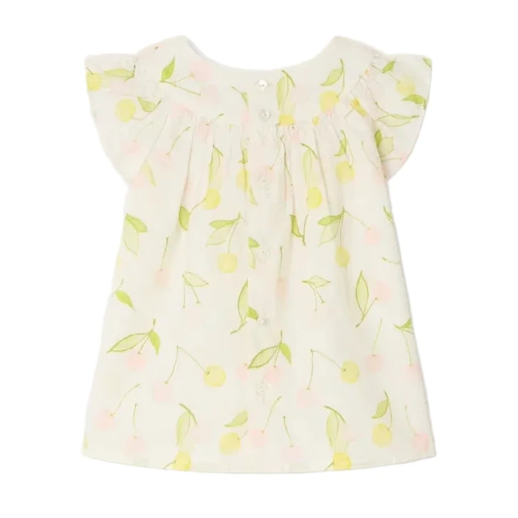 The Bonpoint Baby Girls' and Girls' Lala Blouse is a white organic cotton top with short flutter sleeves, a yellow and green cherry print, and mother-of-pearl buttons, shown laid flat against a white background.