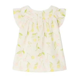 The Bonpoint Baby Girls' and Girls' Lala Blouse is a white organic cotton top with short flutter sleeves, a yellow and green cherry print, and mother-of-pearl buttons, shown laid flat against a white background.