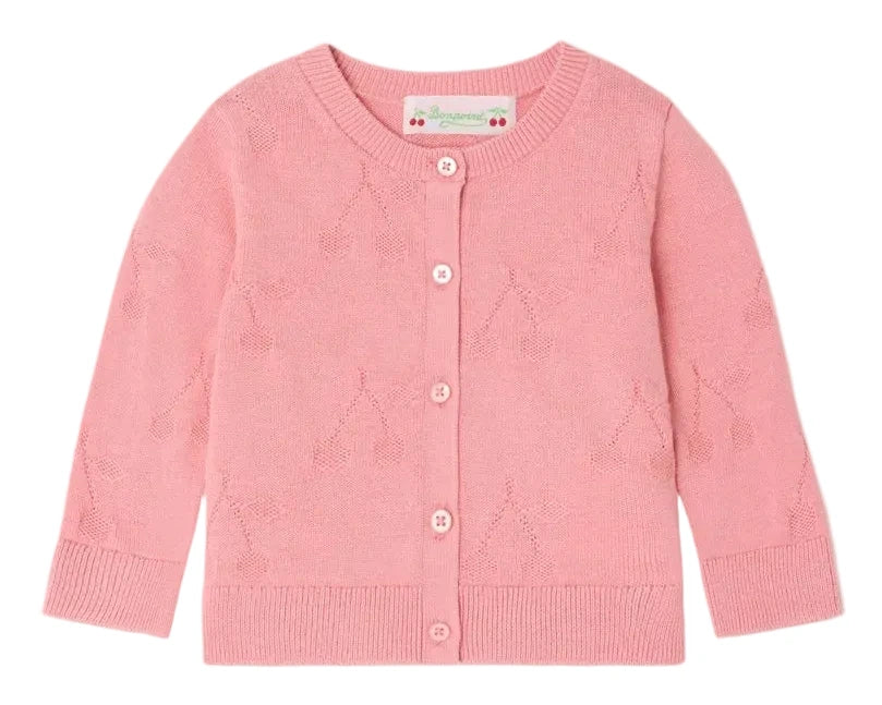 The Bonpoint Baby Girls' and Girls' Teyana Cardigan is a light pink organic cotton cardigan with a subtle cherry pattern, round neckline, long sleeves, and front button closure.