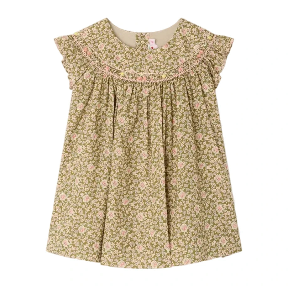 The Bonpoint Baby Girls' and Girls' Amantine Smocked Dress features a green floral print, ruffled sleeves, and hand-embroidered smocking at the neckline, shown on a white background.