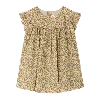 The Bonpoint Baby Girls' and Girls' Amantine Smocked Dress features a green floral print, ruffled sleeves, and hand-embroidered smocking at the neckline, shown on a white background.