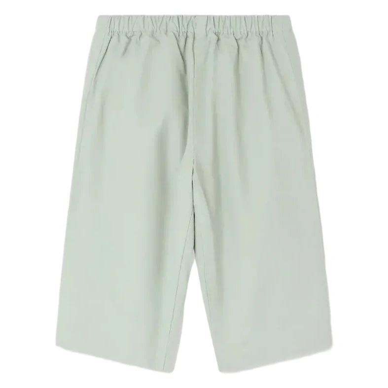 Light green knee-length Baby Boys' Dandy Trousers by Bonpoint, featuring an elastic waistband and side pockets. Shown flat on a white background, these shorts offer comfort and style for your baby.