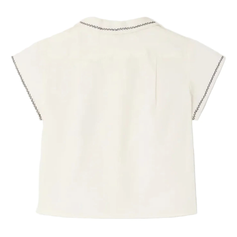 Back view of Bonpoint's Baby Boys' and Boys' Lennard Shirt, an off-white, short-sleeve organic cotton shirt featuring dark stitched details on the collar and sleeve edges.